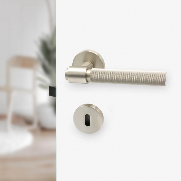 Door handle - Brushed steel - HELIX - Elegant industrialism
