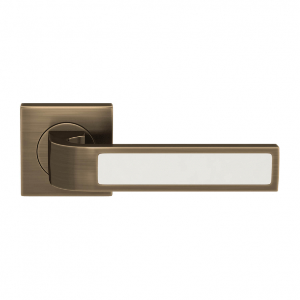 Turnstyle Design Door handle - White leather / Antique brass - Model R1022