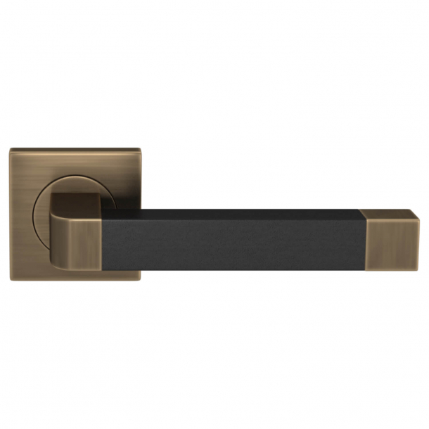 Klamka do drzwi - Turnstyle Designs - Czarna skóra / Antyczny mosi&#261;dz - Model R2030