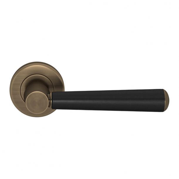 Turnstyle Design Door handle - Black leather / Antique brass - Model C1000